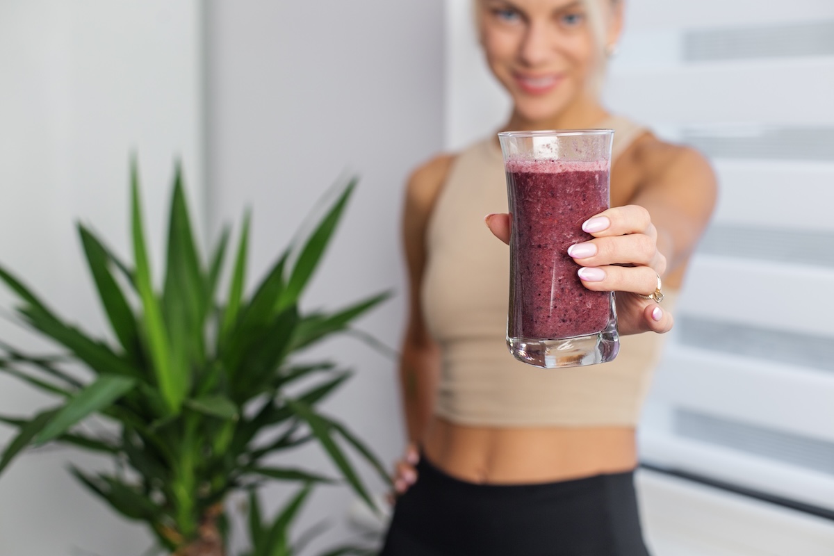 woman-with-glass-of-fresh-smoothie-at-home-space-2026-01-05-23-16-15-utc