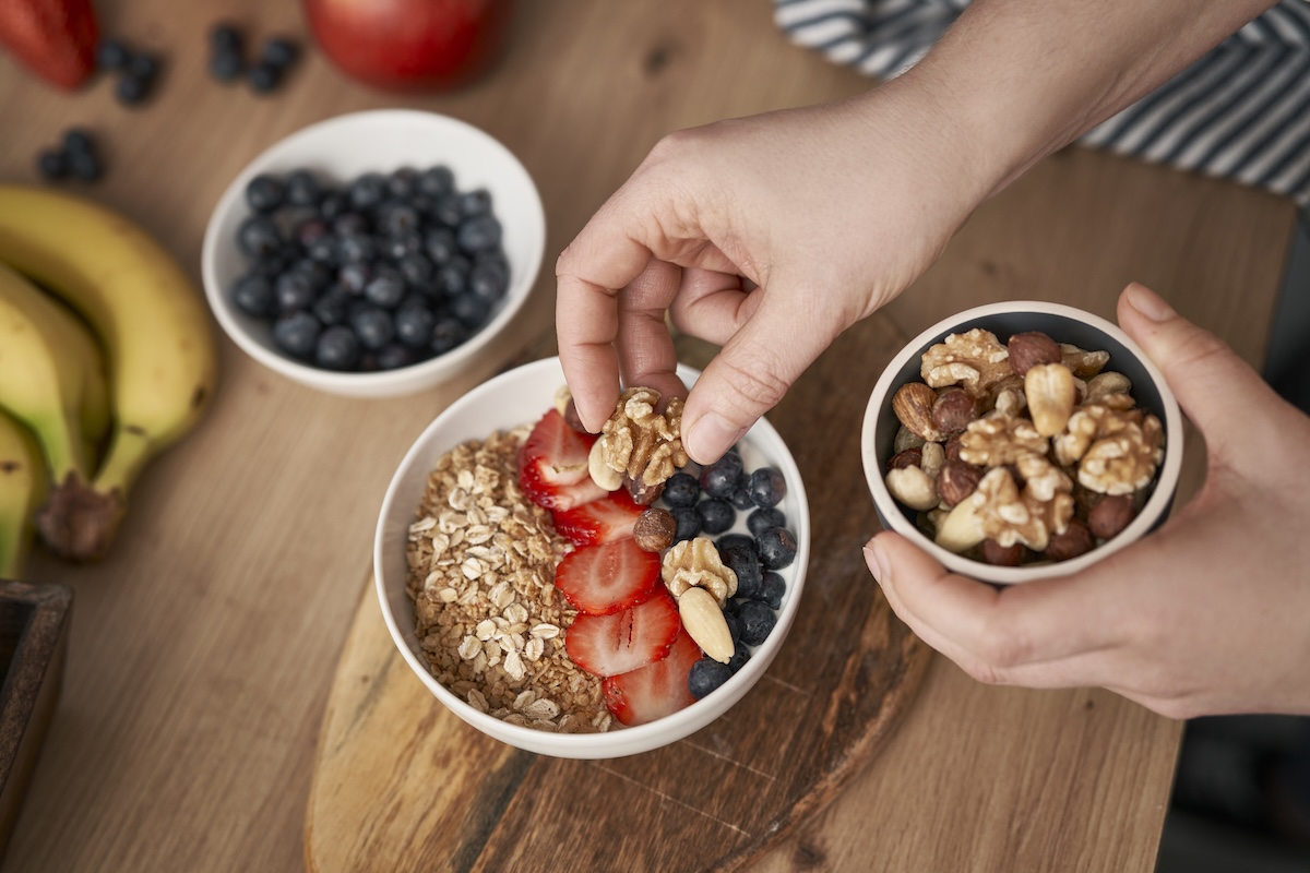 woman-preparing-bowl-with-yogurt-for-breakfast-2026-03-16-01-22-55-utc