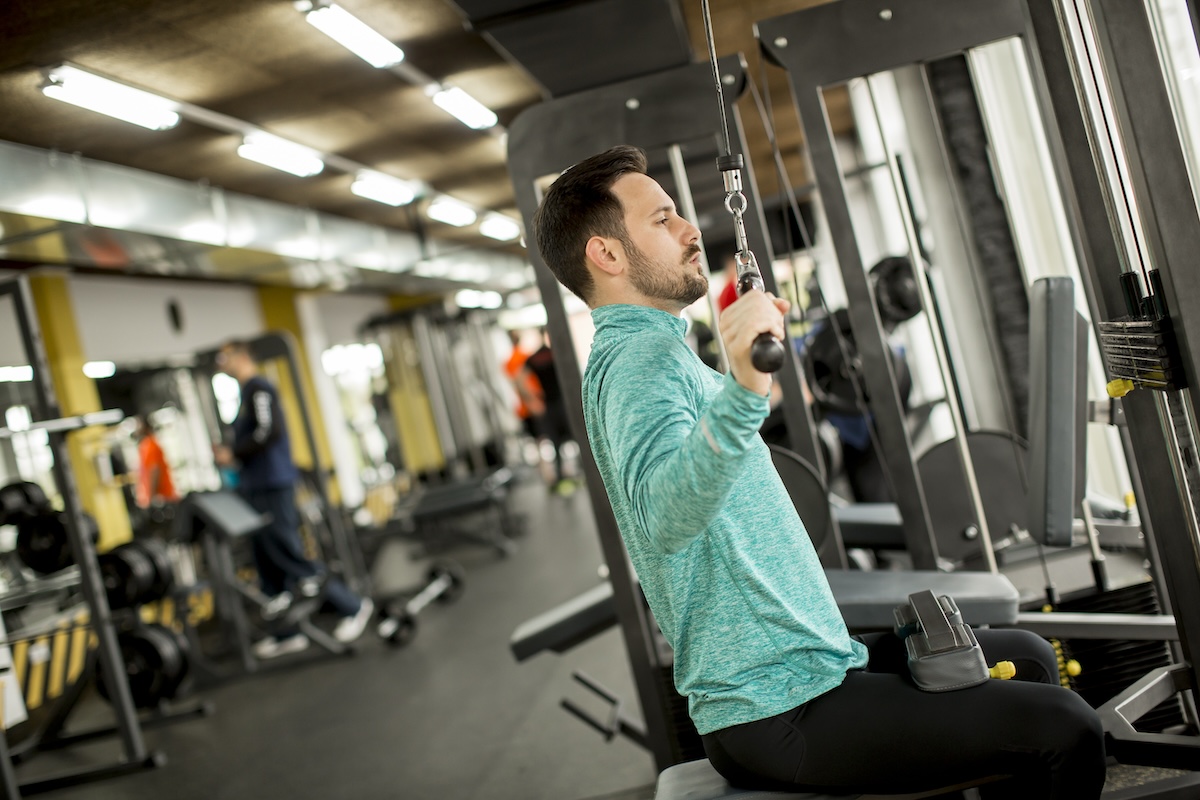 man-doing-excersise-on-a-lat-machine-in-gym-2025-02-21-09-16-33-utc