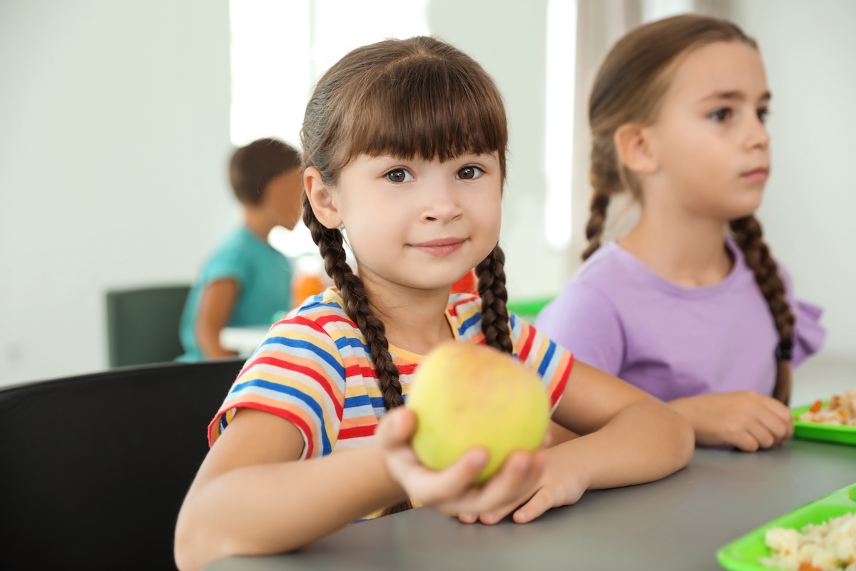 children-sitting-at-table-and-eating-healthy-food-2026-03-05-11-44-29-utc