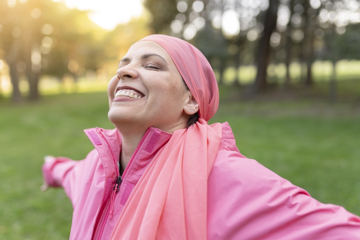 happy-mature-woman-smiling-with-a-pink-scarf-2026-01-08-05-41-23-utc
