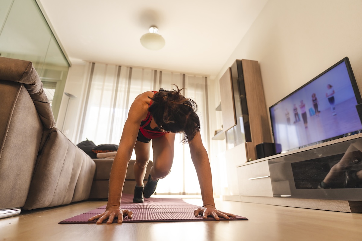 a-young-woman-doing-stretching-in-the-room-followi-2024-12-10-02-15-55-utc