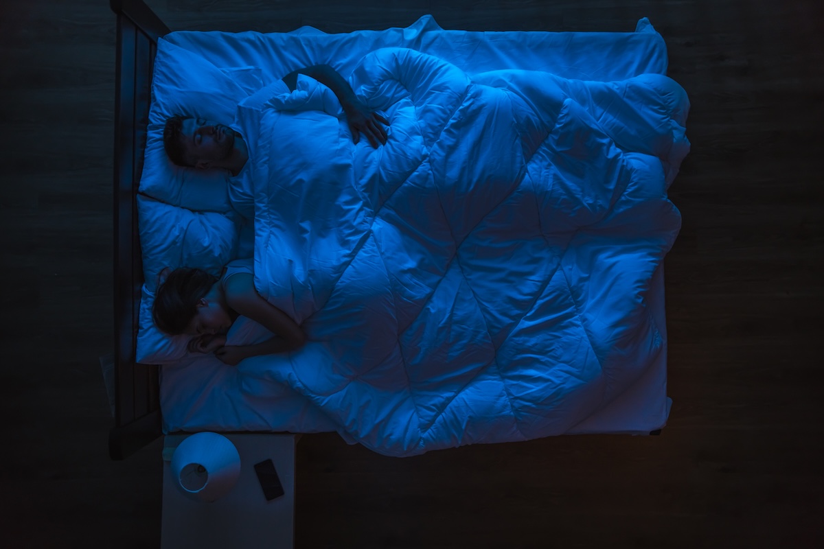 the-couple-sleeping-on-a-bed-evening-night-time-2024-12-04-18-16-41-utc