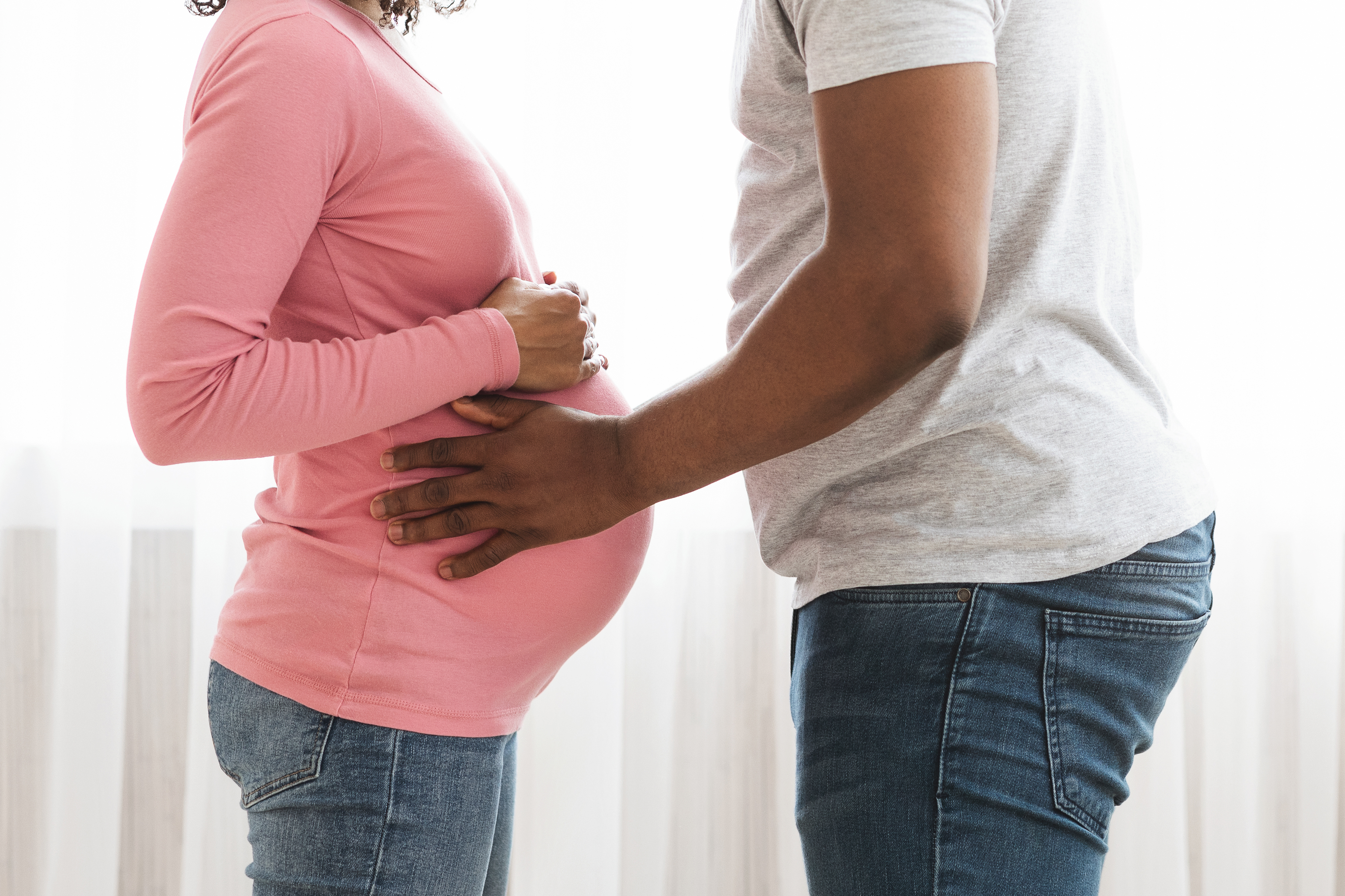 closeup-of-african-american-pregnant-couple-embrac-2022-12-16-07-14-46-utc